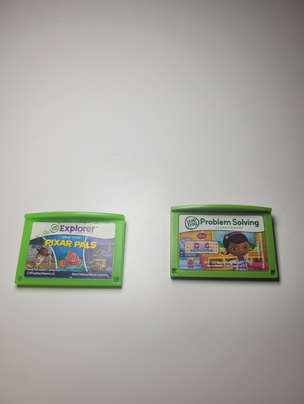 Two Leap Frog Explorer Game Cartridges - Pixar Pals & Doc McStuffins